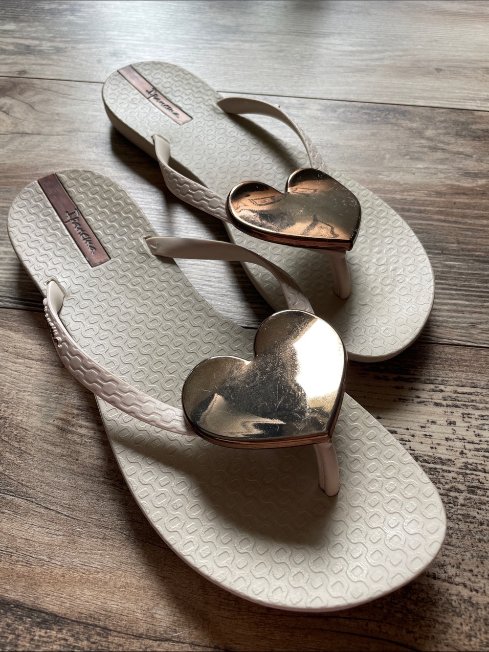 Ipanema Women’s Cream Flip Flops with Rose Gold Heart Accent